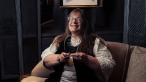 Alison Benn, 2025 Novi Engineering Excellence Award winner, smiling in a professional setting.